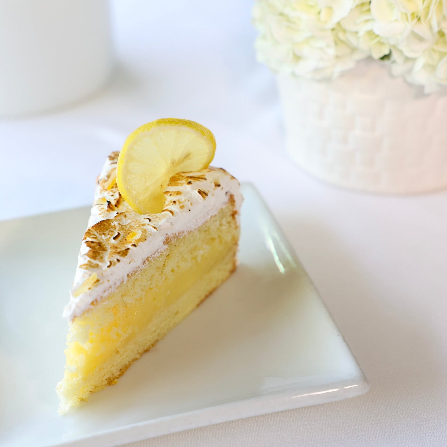 LEMON MERINGUE CAKE SLICE